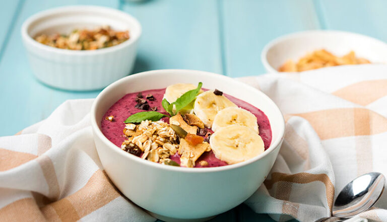 Start your day with a burst of color and flavor by enjoying a delicious berry smoothie bowl.